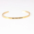 Minimalist gold cuff bracelet with See The Good mantra engraving in polished steel - SEE THE GOOD