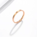 Detailed view of a sleek rose gold stainless steel ring with a polished finish and minimalist design - Rose Gold