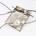 Black mesh drawstring gift bag featuring gold and silver skull patterns for Halloween - Black Gold Skull