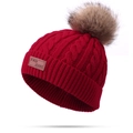 Red cable knit beanie for children featuring dual brown faux fur pom poms and leather tag - Single Pom Pom / Burgundy