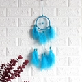 Handmade sky blue dream catcher wall hanging with feathers and beads on white wall - Hanging Style / Blue