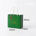 Green Christmas gift bag with gold Merry Christmas print in size M, 22x20x10cm - M Green - Christmas Time Gift Bag