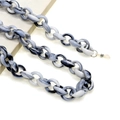 Macro detail of black and white marble acrylic eyeglass chain with secure metal lobster clasp - Black and White Marble