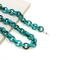 Detail of teal blue acrylic eyeglass chain with leopard pattern and silicone ends - Turquoise Brown Patchwork