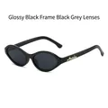 Gafas de sol ojo de gato negro brillante con lentes grises y logo dorado - Montura Negra Lentes Gris Negro