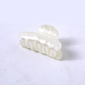 Detail of a large pearlescent white acetate hair claw clip on a minimalist background - White Water Ripple Square Head