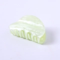 Detail of light green acetate claw clip with marbled texture and pearlescent finish - Aqua Green Water Ripple Round Head