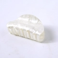 Close-up of pearl white hair claw clip with glossy acetate texture and minimalist design - White Water Ripple Round Head