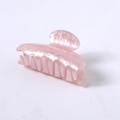 Macro detail of pearlescent pink acetate hair claw clip with smooth rounded teeth - Pink Water Ripple Square Head