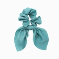 Detail of teal satin fabric hair scrunchie with rabbit ear bow on a white background - Lake Blue