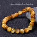 Natuurlijke 8mm gouden tijgeroog armband met kattenoog effect op een donkere basis - Natuurlijke Gouden Tijgeroog (8mm)