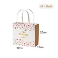 Christmas gift bag with gold Merry Christmas print and rivets in size M 22x10x20cm - M Gold - Christmas Carol Gift Bag