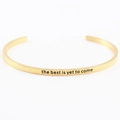 Gold stainless steel cuff bracelet engraved with the best is yet to come mantra - the best is yet to come