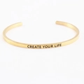Polished gold open mantra bracelet with Create Your Life engraved quote - CREATE YOUR LIFE
