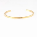 Adjustable gold stainless steel C-shape bracelet with DREAM engraving for couples - DREAM