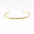 Gold stainless steel C-shaped mantra bracelet with engraved quote for teacher gifts - it takes a big heart to teach little minds