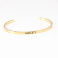 Gold stainless steel C-shaped cuff bracelet with Namaste engraving in polished finish - NAMASTE