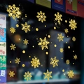 Close-up of glitter gold snowflake window stickers on a cafe glass display - 6616 Gold Glitter Snowflakes Dots