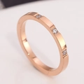 Modern rose gold stainless steel ring featuring three sparkling white round gemstones - US 5 / Rose Gold Triple Diamond