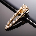 Detailed view of elegant gold hair clip with pearls and sparkling rhinestones - Pearl Rhinestone Teardrop