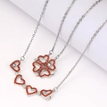 Silver folding necklace with red gems, transforming from four-leaf clover to four hearts - Silver + Red