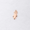 Macro detail of a rose gold boy-shaped mirror stainless steel pendant for jewelry DIY - Boys / Rose Gold