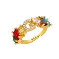 Macro shot of gold G-letter ring with rainbow gemstones and micro-pave crystals - Adjustable Open / Letter G