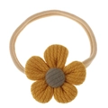 Macro detail of mustard yellow knit flower on a soft beige nylon baby headband - Yellow Five-Petal Flower
