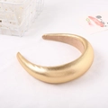 Detailed view of padded wide headband with metallic gold pearlescent texture and beige lining - Padded Sponge Version / Gold