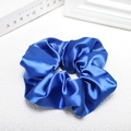 Detailed view of glossy royal blue satin scrunchie with silky smooth fabric texture - Royal Blue