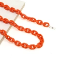Detail of bright orange acrylic eyeglass chain with secure non-slip silicone loops - Orange