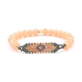 Detail of Miyuki evil eye beaded bracelet with faceted beads and geometric weaving - Symmetrical Rhombus Pattern / Pale Orange