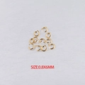 Detailed view of 0.8x6mm gold stainless steel open jump rings for DIY jewelry making - Gold