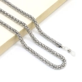 Close-up of 6mm silver metal eyeglass chain with anti-slip silicone loops on a book - Silver