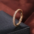 Macro shot of 18K gold plated eternity ring with sparkling claw-set cubic zirconia - US 9 / Gold Plated with White Zirconia