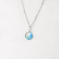 Macro detail of 12mm mermaid scale pendant on a mirror polished stainless steel chain - Blue Pink Gold Iridescent (5)