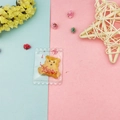 Close-up of yellow resin bear cookie pendant in mini transparent packaging for DIY jewelry - Yellow Bear