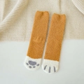 Detailed texture of thick coral fleece socks with ginger yellow cat paw print design - One Size / Ginger Yellow