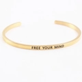 Minimalist gold stainless steel mantra cuff bracelet with Free Your Mind engraving - FREE YOUR MIND