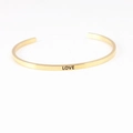 Minimalist gold stainless steel open mantra bracelet with LOVE engraved on the surface - LOVE