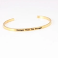 Golden open C-shape mantra bracelet with Stronger Than The Struggle engraving - STRONGER THAN THE STRUGGLE
