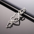 Minimalist silver metal heart wing hair clip with hollow design on black reflective surface - Silver Cupid Heart Hairclip