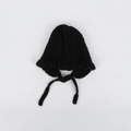 Detailed close-up of a black cable knit baby bonnet with ruffle edges and secure chin straps - Kids (46-50CM) / Black