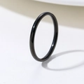 Minimalist slim black polished stainless steel ring shown from a 45-degree angle - Black