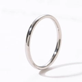 Macro shot of minimalist polished stainless steel ring with a smooth silver-tone finish - Steel