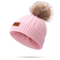 Pink cable knit winter hat for children featuring a fluffy brown faux fur pom-pom topper - Single Pom Pom / Light Pink