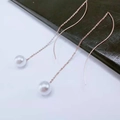 Elegant rose gold long threader earrings with white pearls on dark leather background - White Pearl (8310)