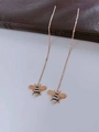 Close-up of titanium tassel earrings featuring a detailed bee motif in rose gold finish - Little Bee (8315)