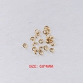 Golden 0.8x4mm stainless steel open jump rings set on a grey textured background - Gold 0.8*4mm (100 Pcs)