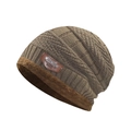Detail of brown knitted beanie showing thick fleece lining and leather patch label - Khaki